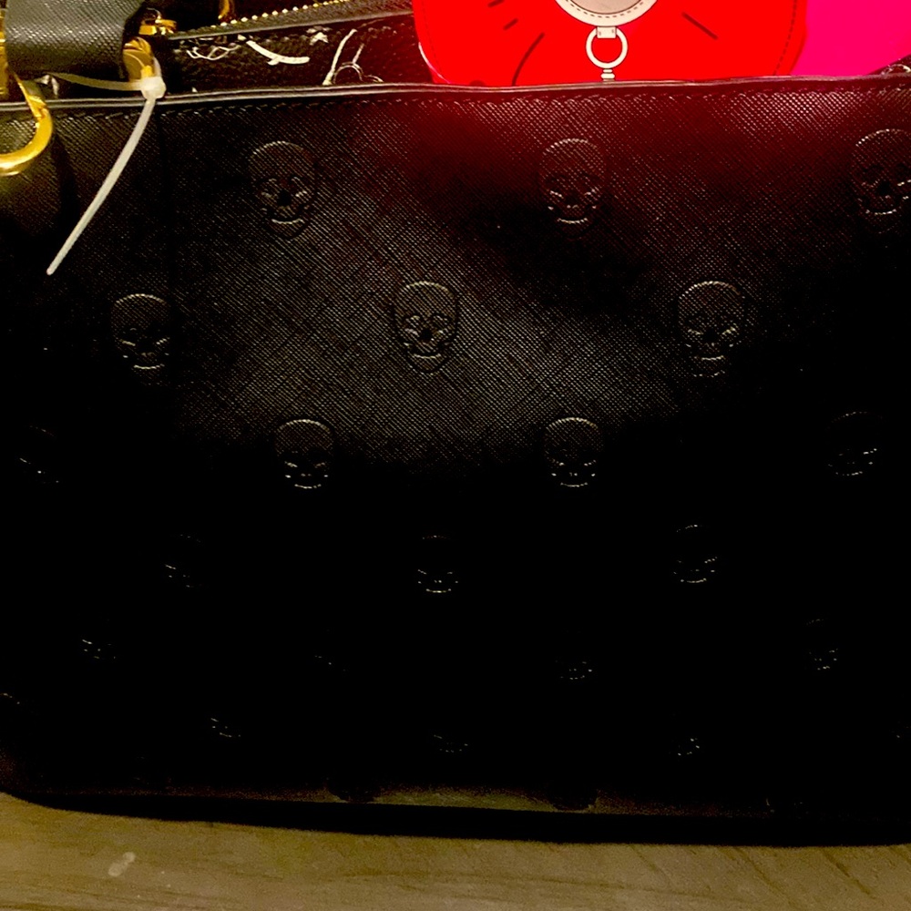Betsy Johnson black embossed skull handbag